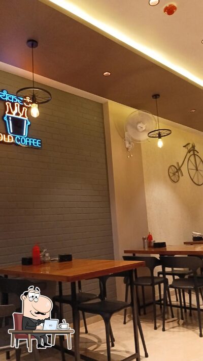 Take a seat at one of the tables at The Retro Cafe