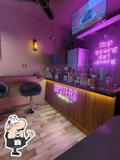 Take a seat at one of the tables at SIPSTERS