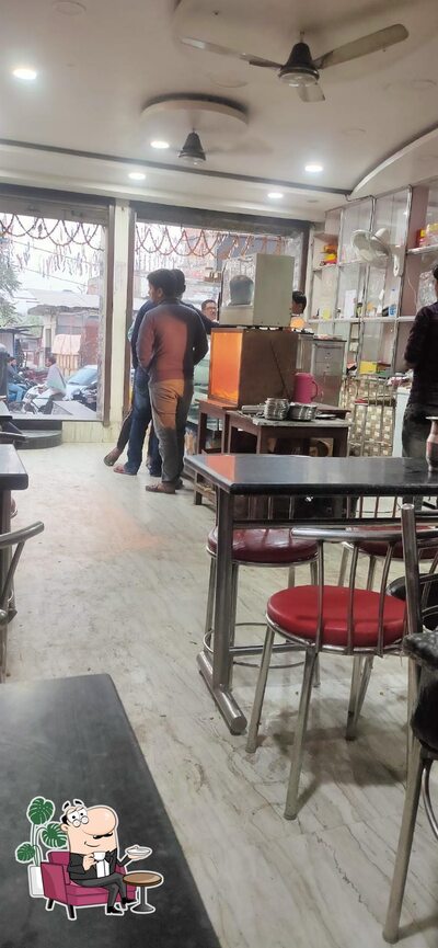 Take a seat at one of the tables at R K Sweets and Chat Corner