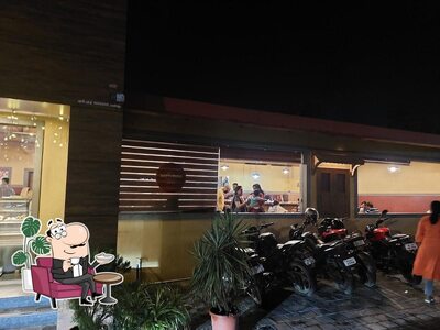 Take a seat at one of the tables at Gokul Oottupura Vegetarian - NH Bypass, Padivattom, Edappally