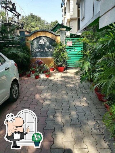 Enjoy the view at the outside area of Navratna - Hotel Green Acres