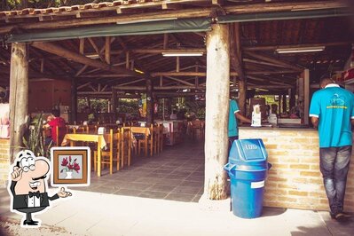 Sente em uma das mesas no Pesqueiro E Restaurante Valeri Quiririm