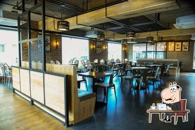 Take a seat at one of the tables at Fika Coffee House