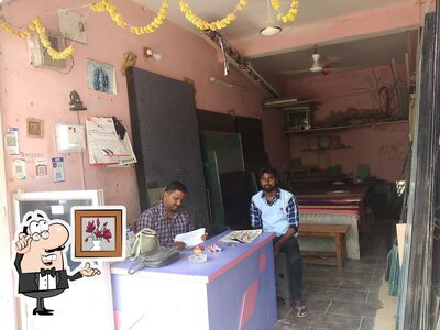 Take a seat at one of the tables at Sri Durga Bhavani Mess