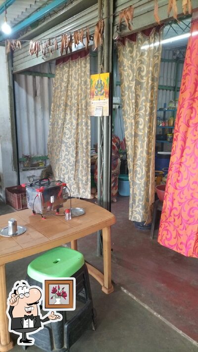 Take a seat at one of the tables at Chithra Mess &Fast Food சித்ரா மெஸ் &பாஸ்ட் புட்