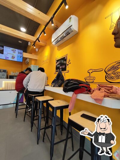 Take a seat at one of the tables at The Belgian Waffle Co