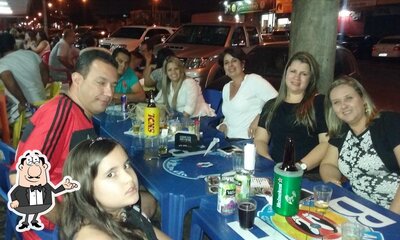 Sente em uma das mesas no Distribudora De Bebidas Ramos