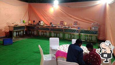 Take a seat at one of the tables at Vasant Gaon, vasant vihar new delhi