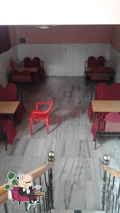Take a seat at one of the tables at Duck Chik The Fooding Point