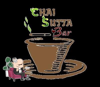 Take a seat at one of the tables at Chai Sutta Bar Hisar