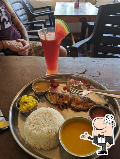 Take a seat at one of the tables at Little Ganesha