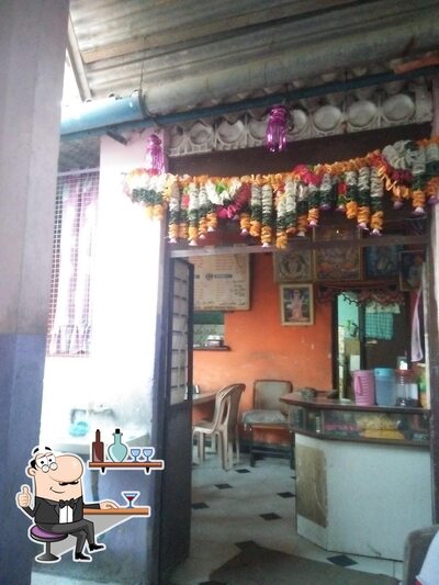 Take a seat at one of the tables at Bhanu Mistri Cha Dhaba ( Pragati )