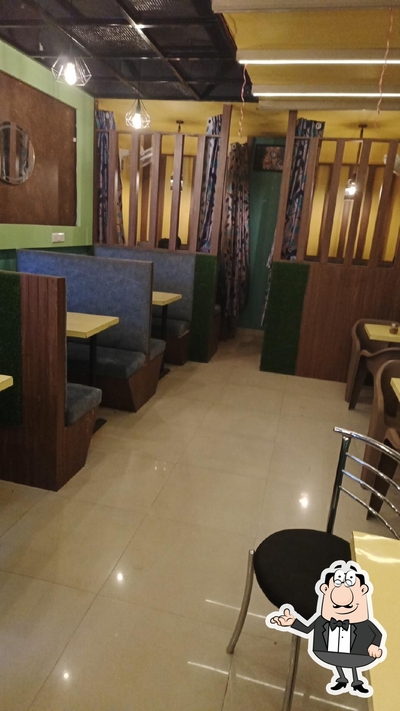 Take a seat at one of the tables at Moon light cafe