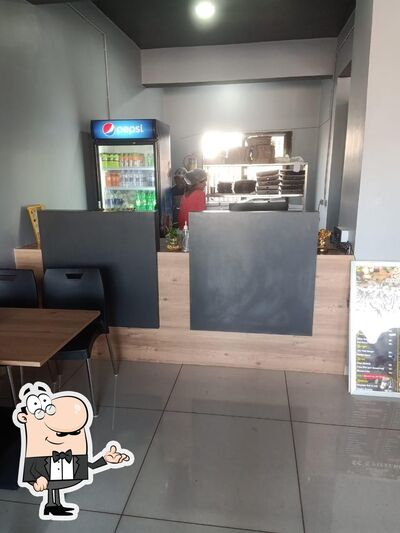 The interior of SS'S Pizzeria Pizza Restaurant In Vyara Fast Food Restaurant In Vyara Snacks Restaurant In Vyara