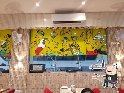 Take a seat at one of the tables at OTR-On The Road Multi Cuisine Restaurant By Mewad place Sanand Gujarat