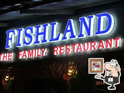 Take a seat at one of the tables at Fishland Restaurant