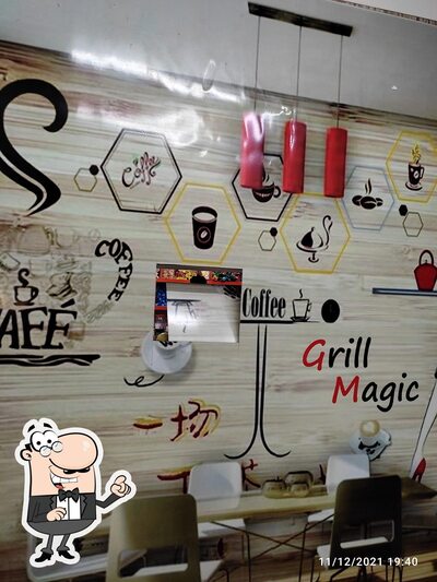 Take a seat at one of the tables at Grill magic
