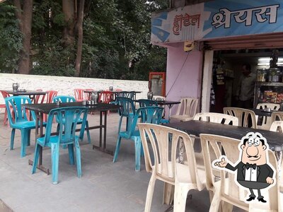 Take a seat at one of the tables at Hotel Shreyas