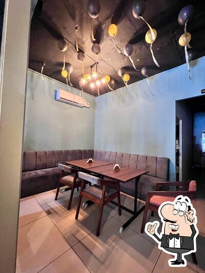 Take a seat at one of the tables at Chai Sutta Bar