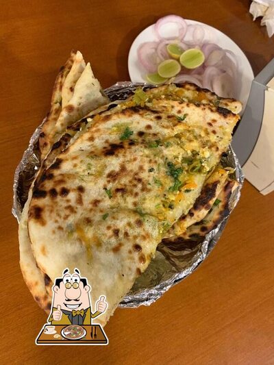 Get pizza at Neighbourhood Cafe