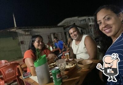 Sente em uma das mesas no OXENTE VIP