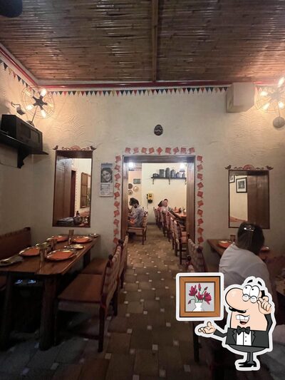 Take a seat at one of the tables at Dhaba