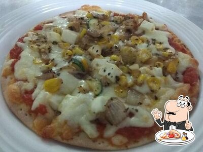 Try out pizza at Aangan