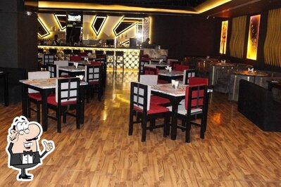 Take a seat at one of the tables at TIP-C Resto Lounge