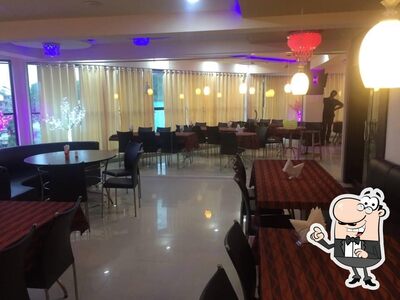 Take a seat at one of the tables at Platinum Restaurant & Cafe