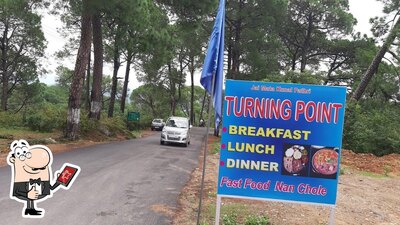 The logo of Turning point cafe