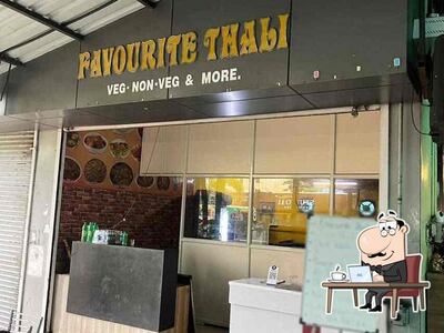 Take a seat at one of the tables at Favourite Thali