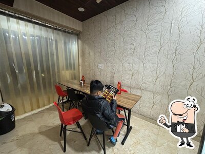 Take a seat at one of the tables at Ananya's