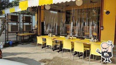 Take a seat at one of the tables at Udupi Cafe North India