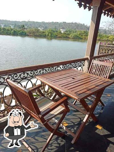 Take a seat at one of the tables at Cafe Amrapali