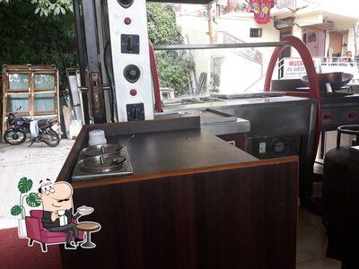 Take a seat at one of the tables at Anand Restaurant
