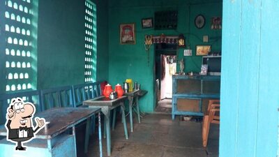 Take a seat at one of the tables at Santosh Tea House