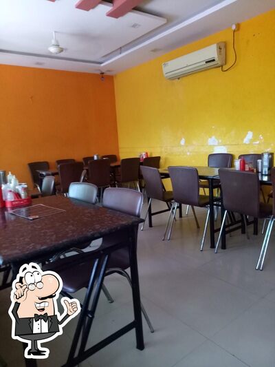 Take a seat at one of the tables at SF Dosa Corner