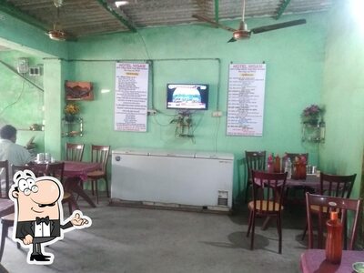 Take a seat at one of the tables at Hotel Nigam