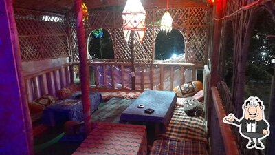 Take a seat at one of the tables at Tapasya Cafe