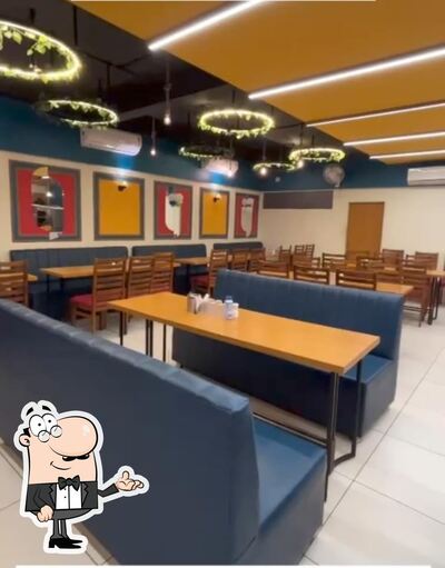 Take a seat at one of the tables at GOPI KATHIYAWADI
