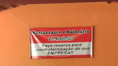 O logotipo do Restaurante e Balneário do Gaúcho