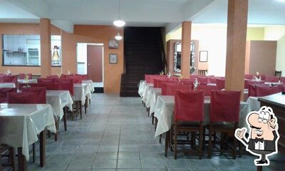 Sente em uma das mesas no Cozinha da Mamma III Garopada SC