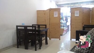 Take a seat at one of the tables at Grills Café