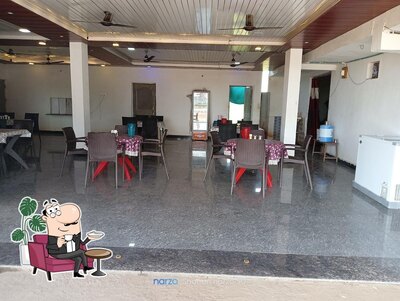 Take a seat at one of the tables at MR MODEL CAFE