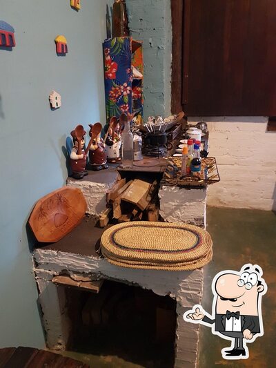 Sente em uma das mesas no Bar e Restaurante Maria Maria's Trancoso