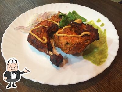 Take a seat at one of the tables at Qwick Grab Roll( Kathi rolls n more)