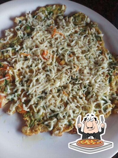 Get pizza at Paradise Pool Side Restaurant