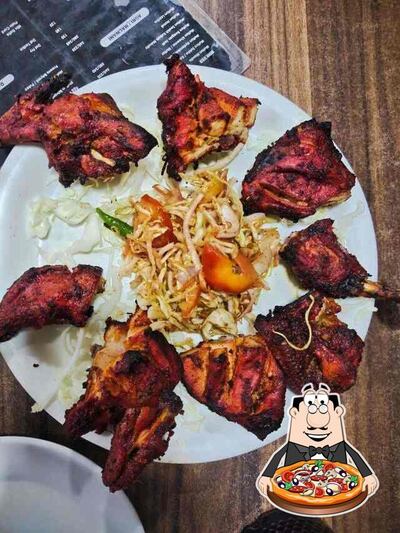 Try out pizza at Tandoori Kitchen Family Restaurant