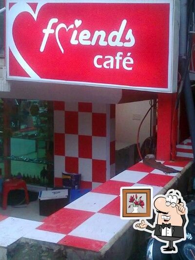 Take a seat at one of the tables at Friends Cafe