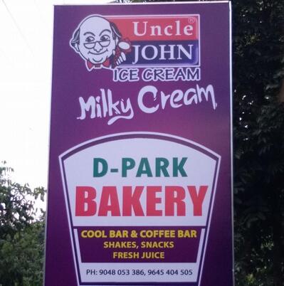 The advertisement displays information about D PARK Bakers Manimala